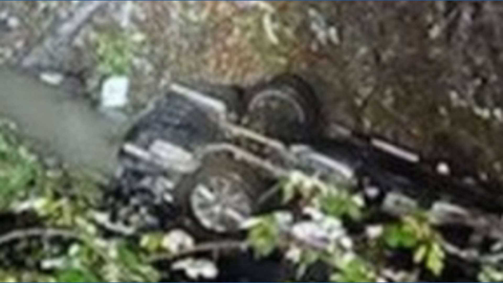 Rescuers recover driver after crash down embankment in Troutdale