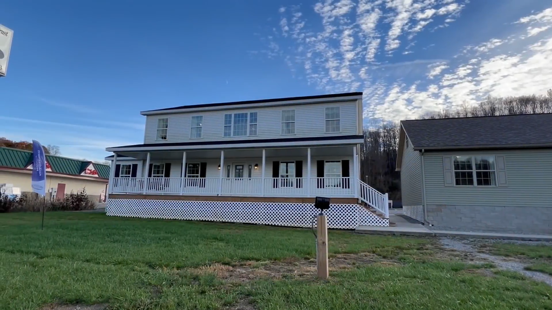 A country porch gives this spacious modular home extra charm