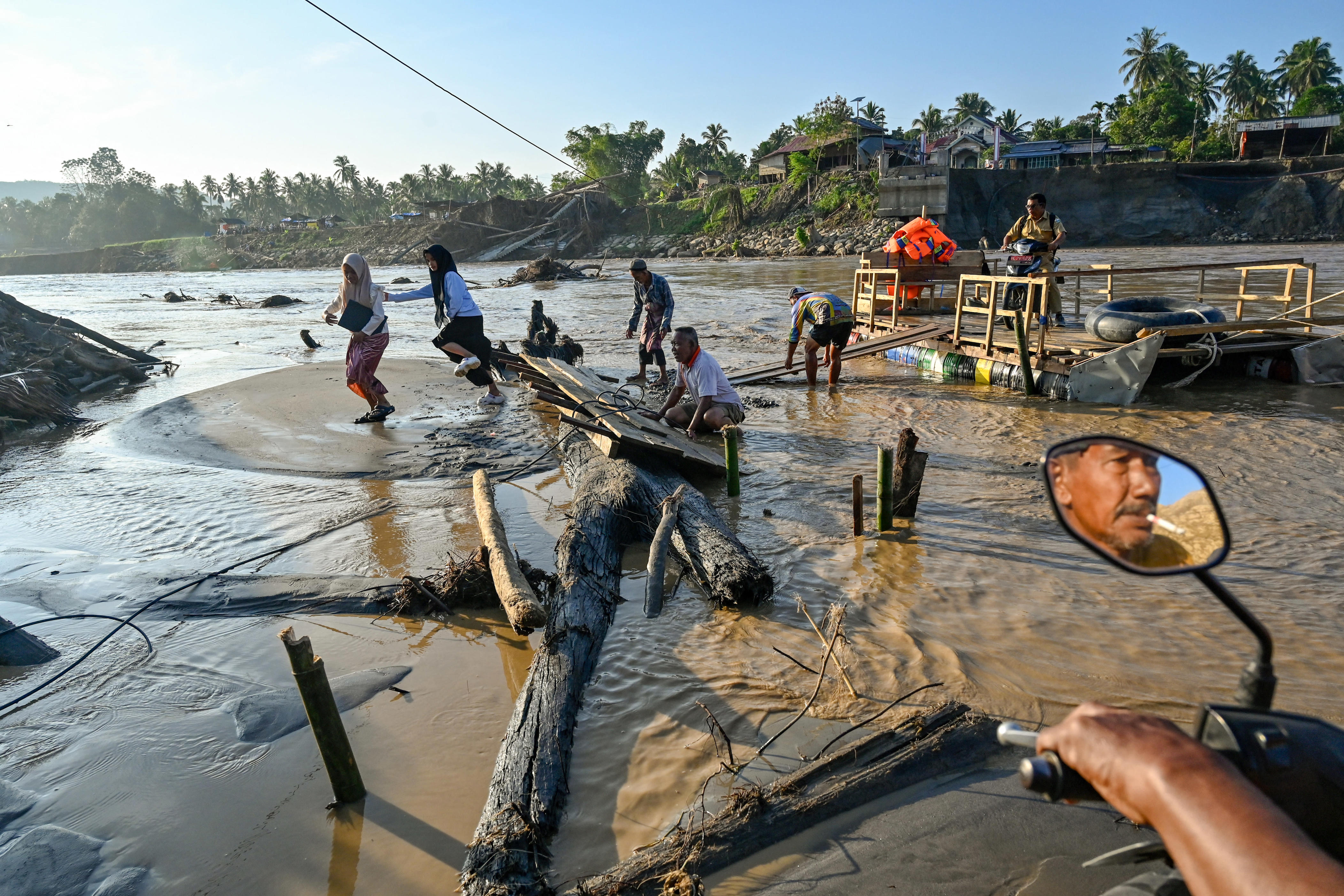 Flash floods in Indonesia's North Sulawesi kill 14, four still missing