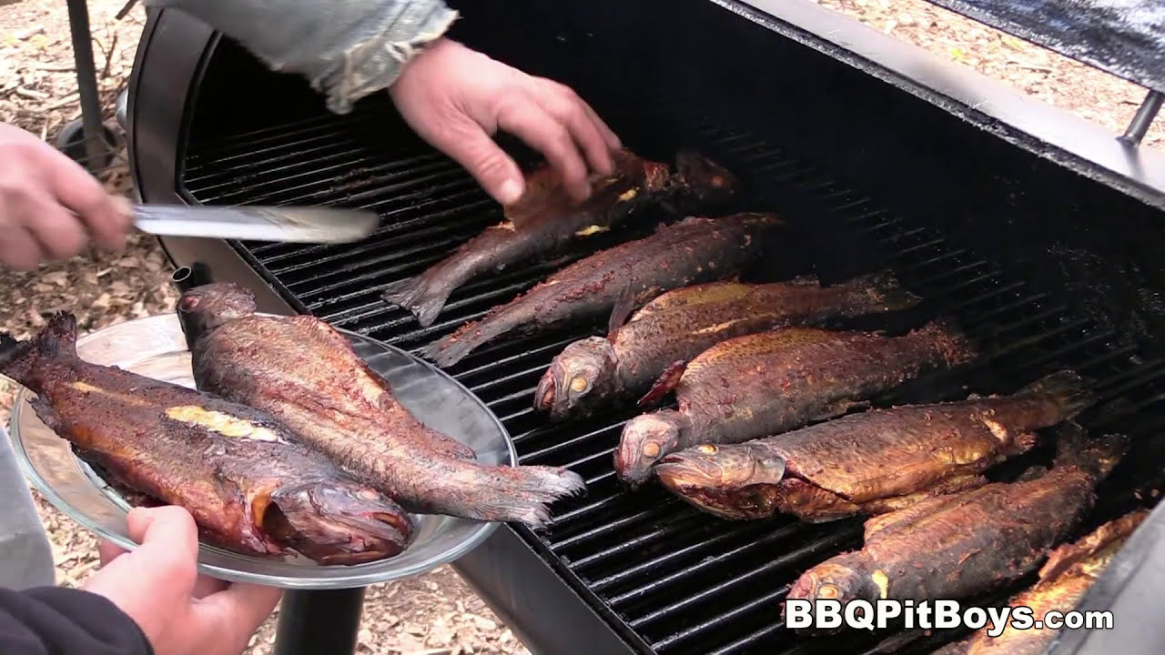 Fresh trout get smoked for four hours and butter-poached on the grill