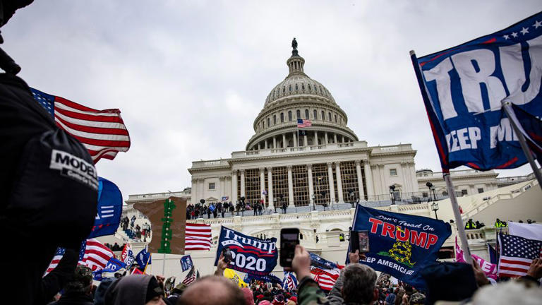 Trump supporters storm the US Capitol following a rally with President Donald Trump on January 6, 2021. - Samuel Corum/Getty Images
