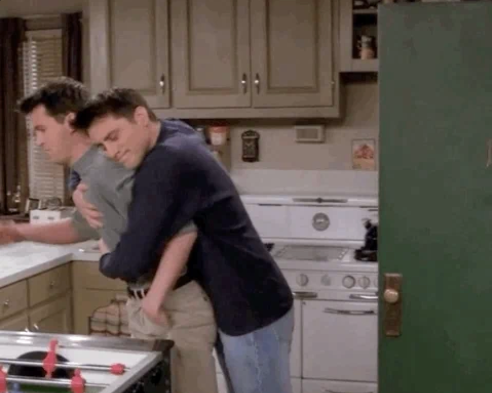 Joey hugs Chandler on "Friends"
