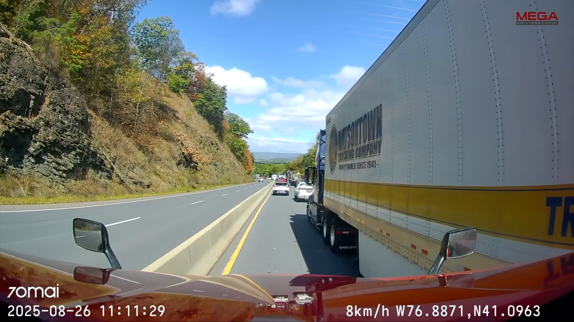 Car gets sandwiched between truck and barrier