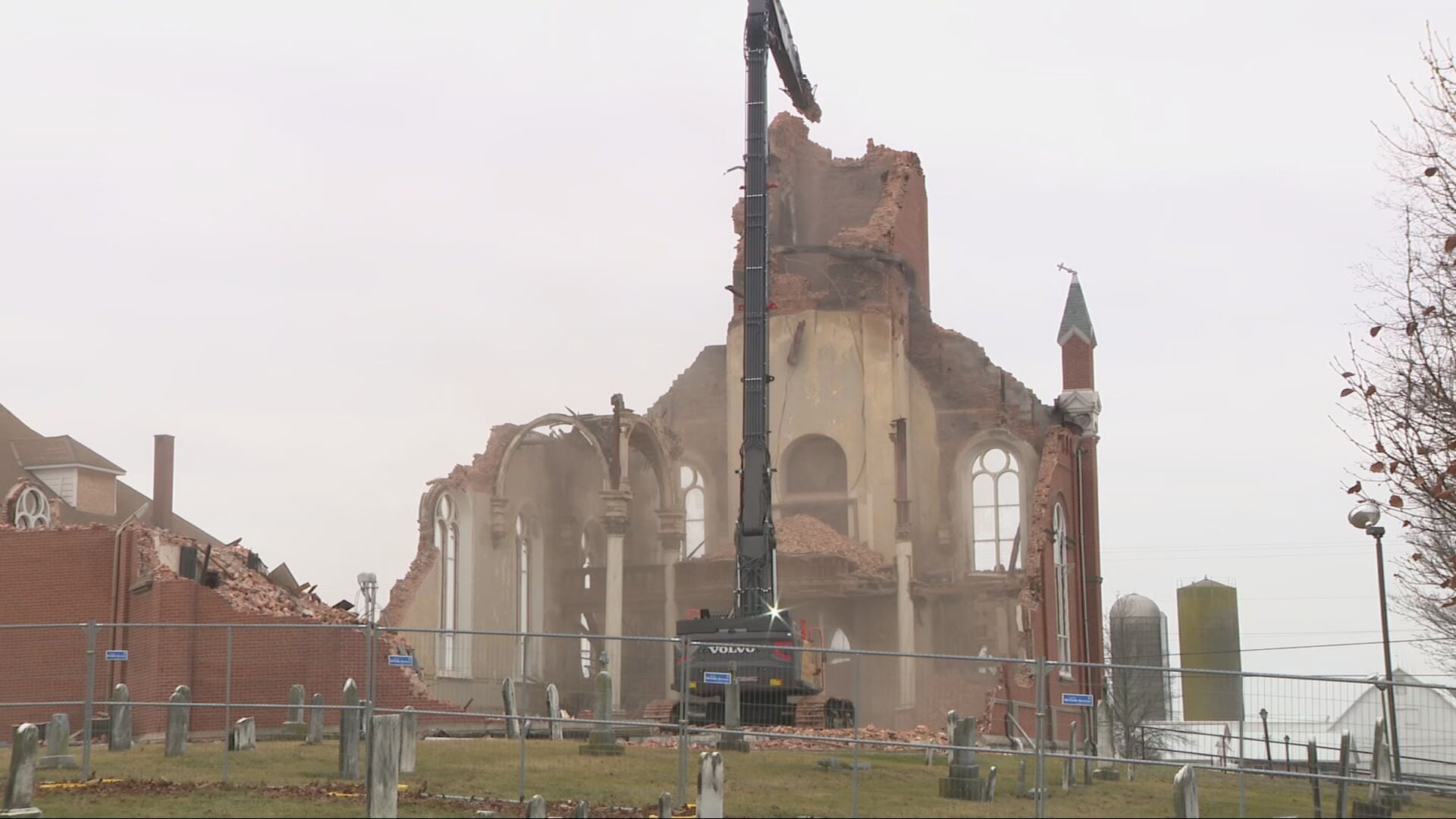 Community watches as final portion of historic Catholic church is torn down