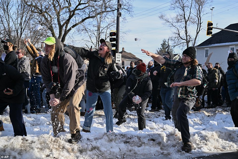 Protesters burn flag after woman shot dead by ICE agent in Minneapolis