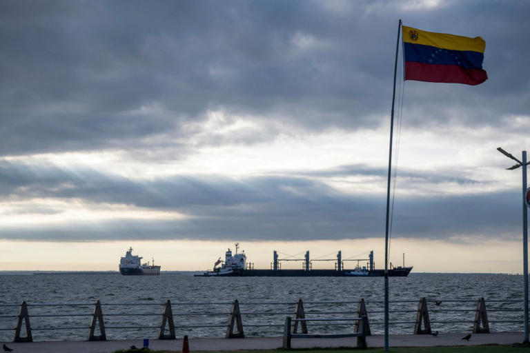 Bulk carrier Ithaca Patience, right, and crude oil tanker Nord Star, both from Panama, are seen anchored in Lake Maracaibo, Venezuela, on January 7.
