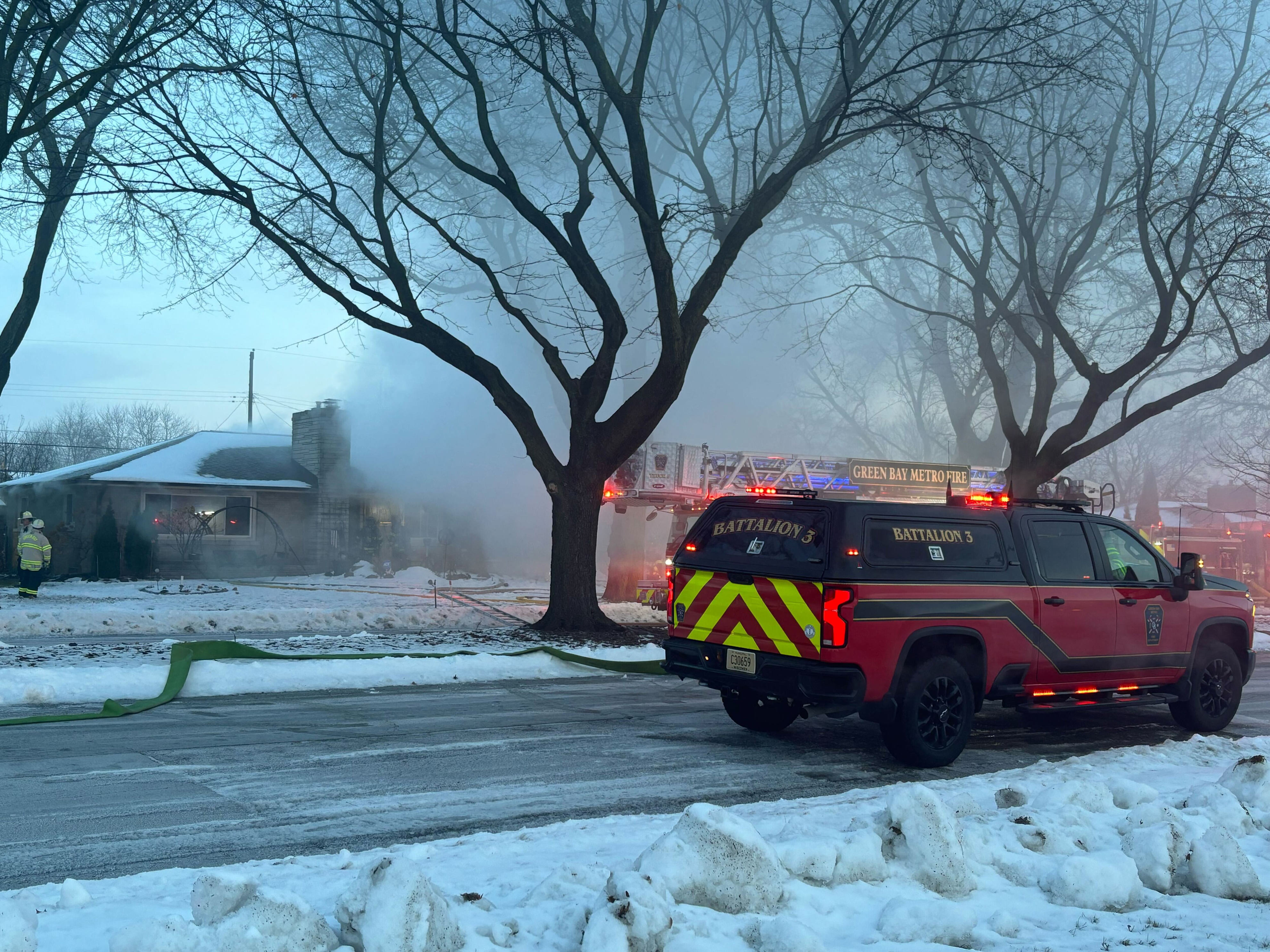 Three people treated at hospital after Green Bay house fire