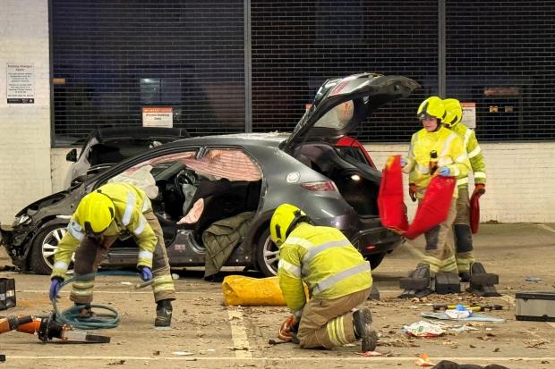 Two people rescued from serious car park crash