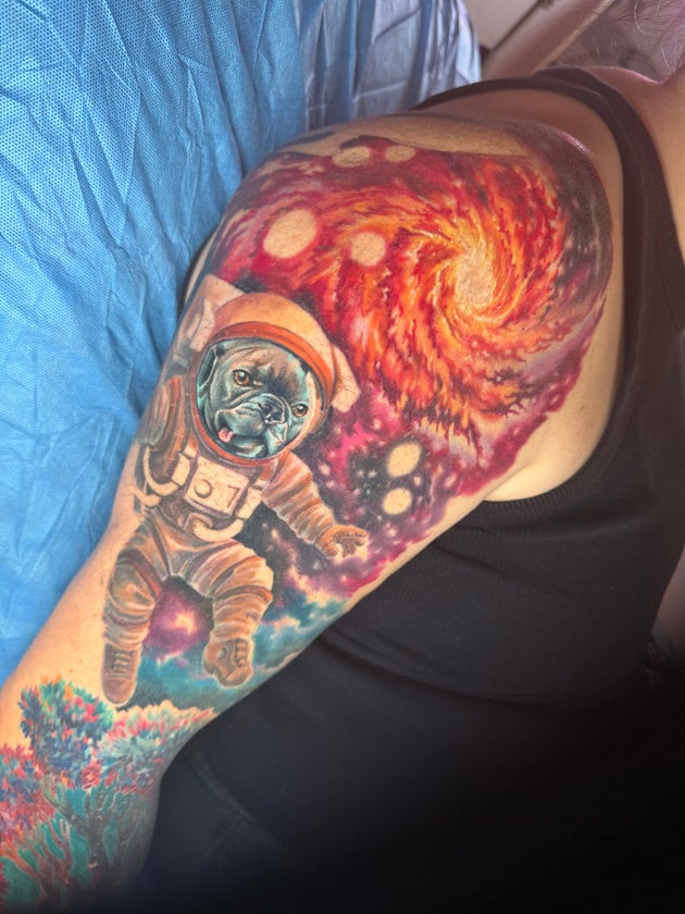 The author's not-quite-done right arm sleeve, including her dog, Pooter, depicted as an astronaut.