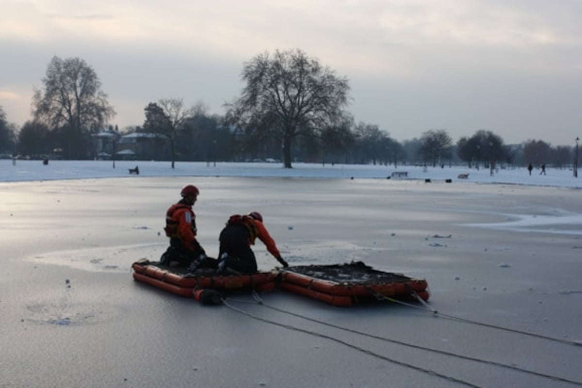 Two children rescued from frozen pond in east London as warning issued