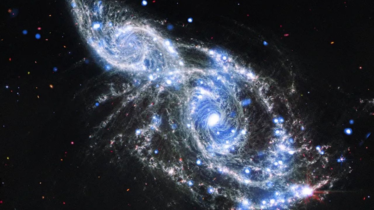 Space telescopes capture breathtaking galactic hug | Space photo