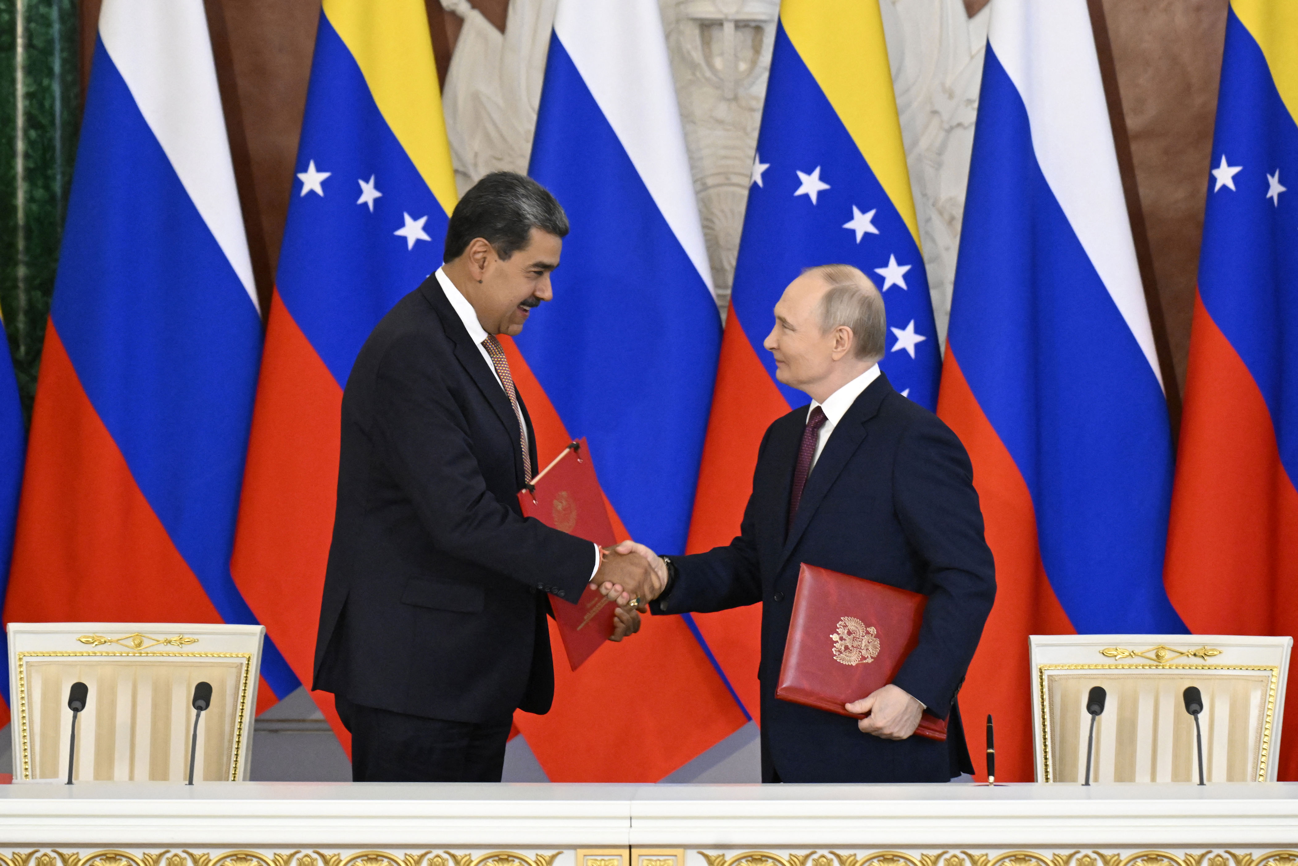 Russian President Vladimir Putin and Maduro attend a signing ceremony following their talks at the Kremlin in May.