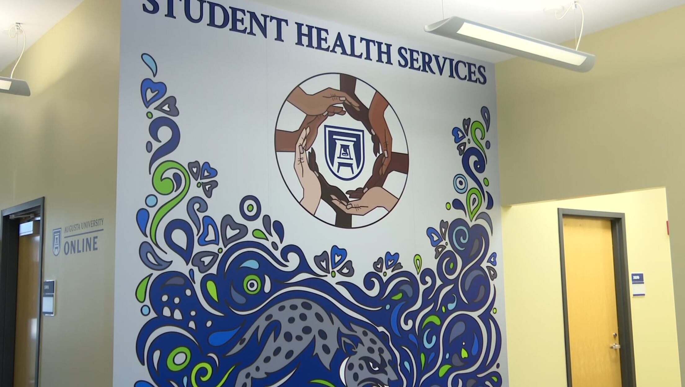AU cuts ribbon on new student health services building