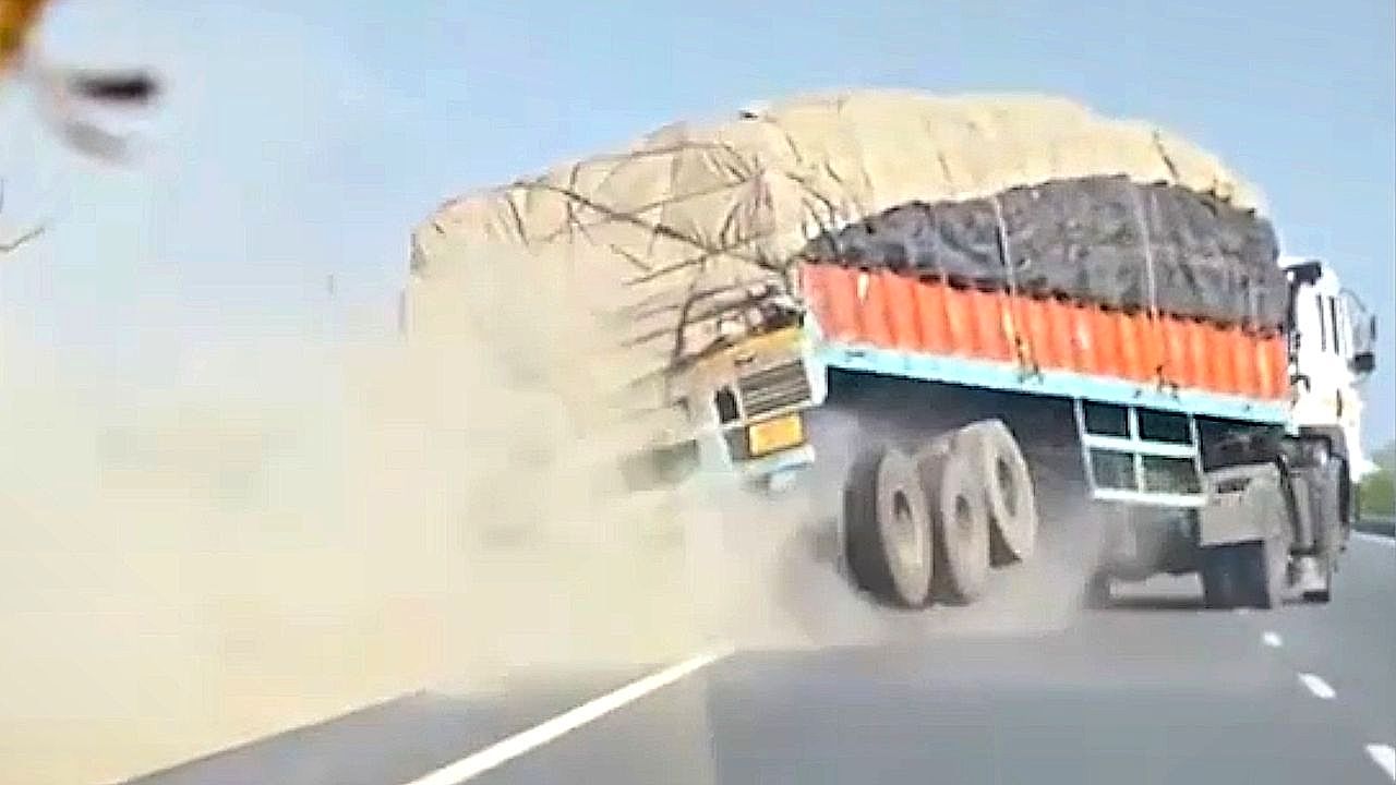 Truck overturns, spilling barley across busy highway