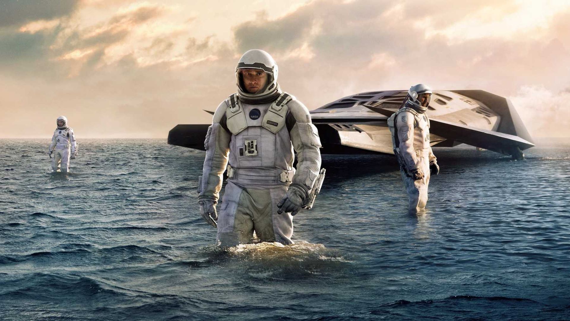 Matthew McConaughey as Cooper, next to a floating space ship in Christopher Nolan's Interstellar.