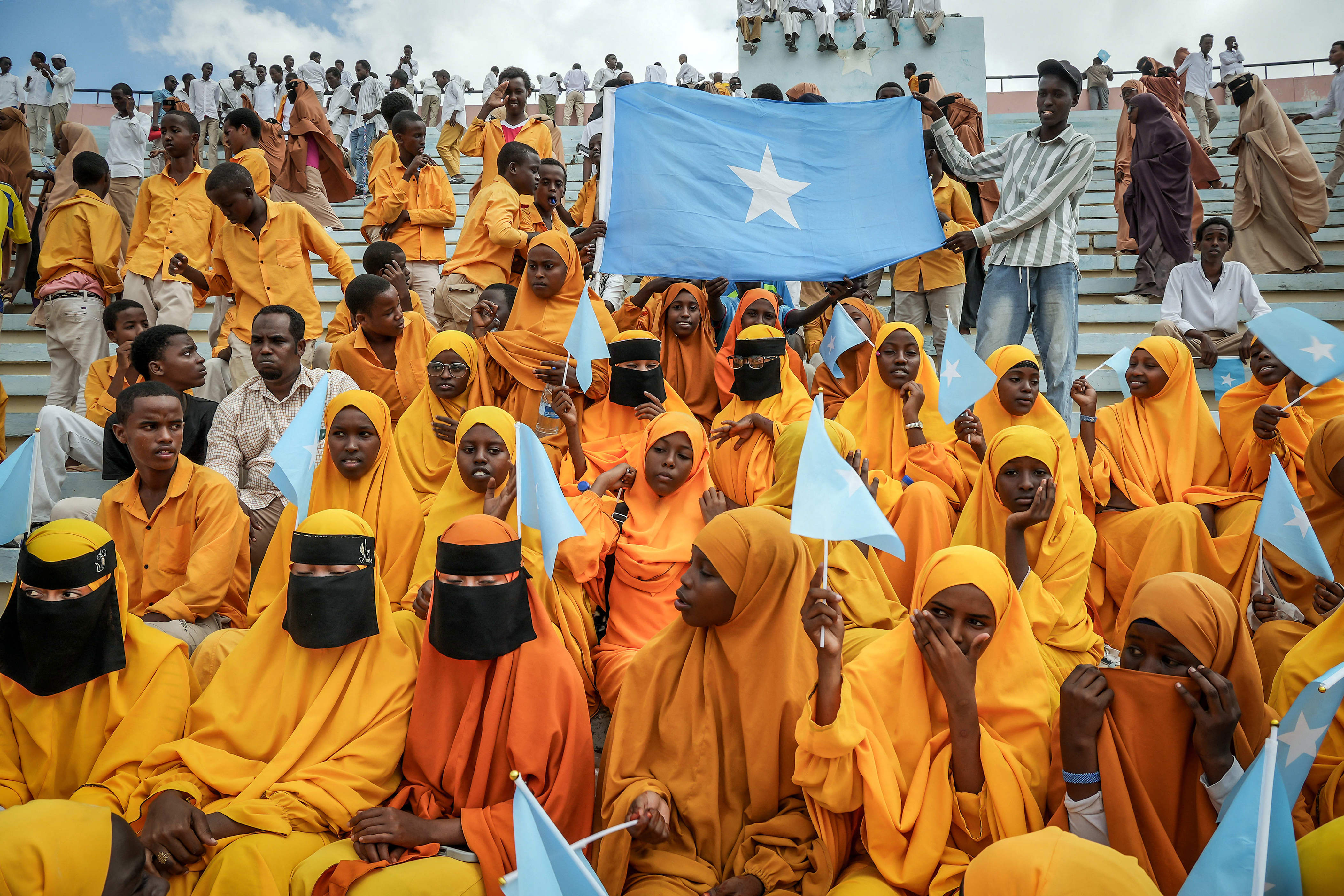 Residents wave Somali flags as they attend a rally denouncing Israel’s recognition of the breakaway Somaliland region, during a gathering calling for Somalia’s territorial unity, in Mogadishu, Dec. 30.