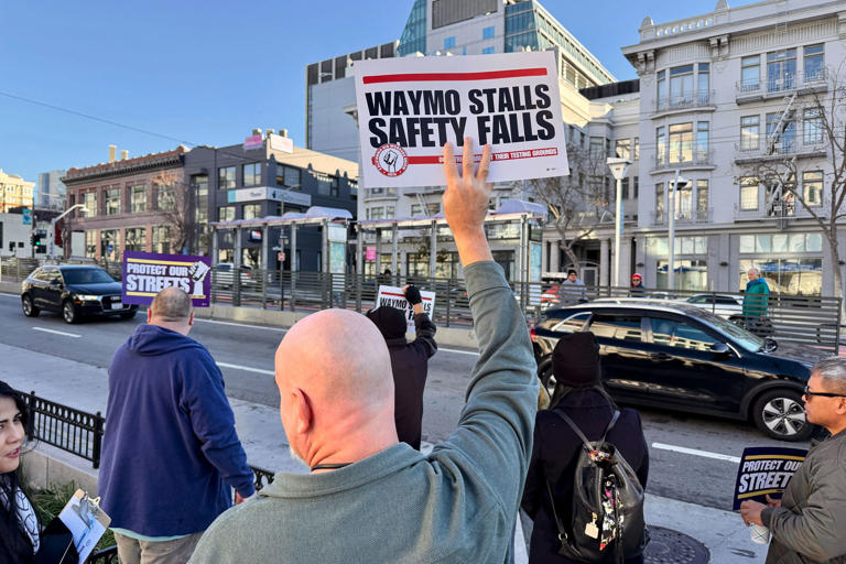 Lyft and Uber drivers protest over rise of self-driving robotaxis