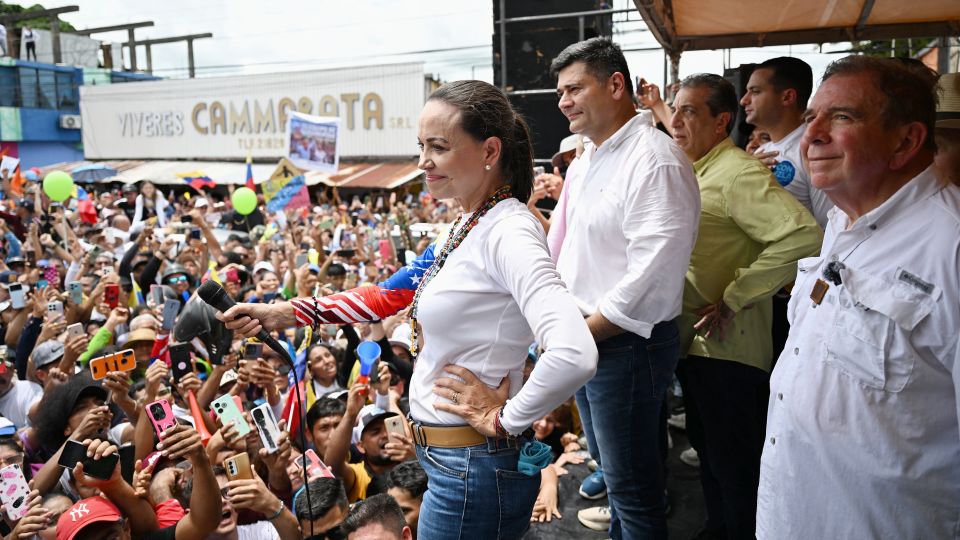 Venezuelan opposition leader Maria Corina Machado (L) gestures next to Venezuelan presidential candidate Edmundo Gonzalez (R) during a campaign rally in Barinas, Venezuela, on July 6, 2024. - Juan Barreto/AFP/Getty Images