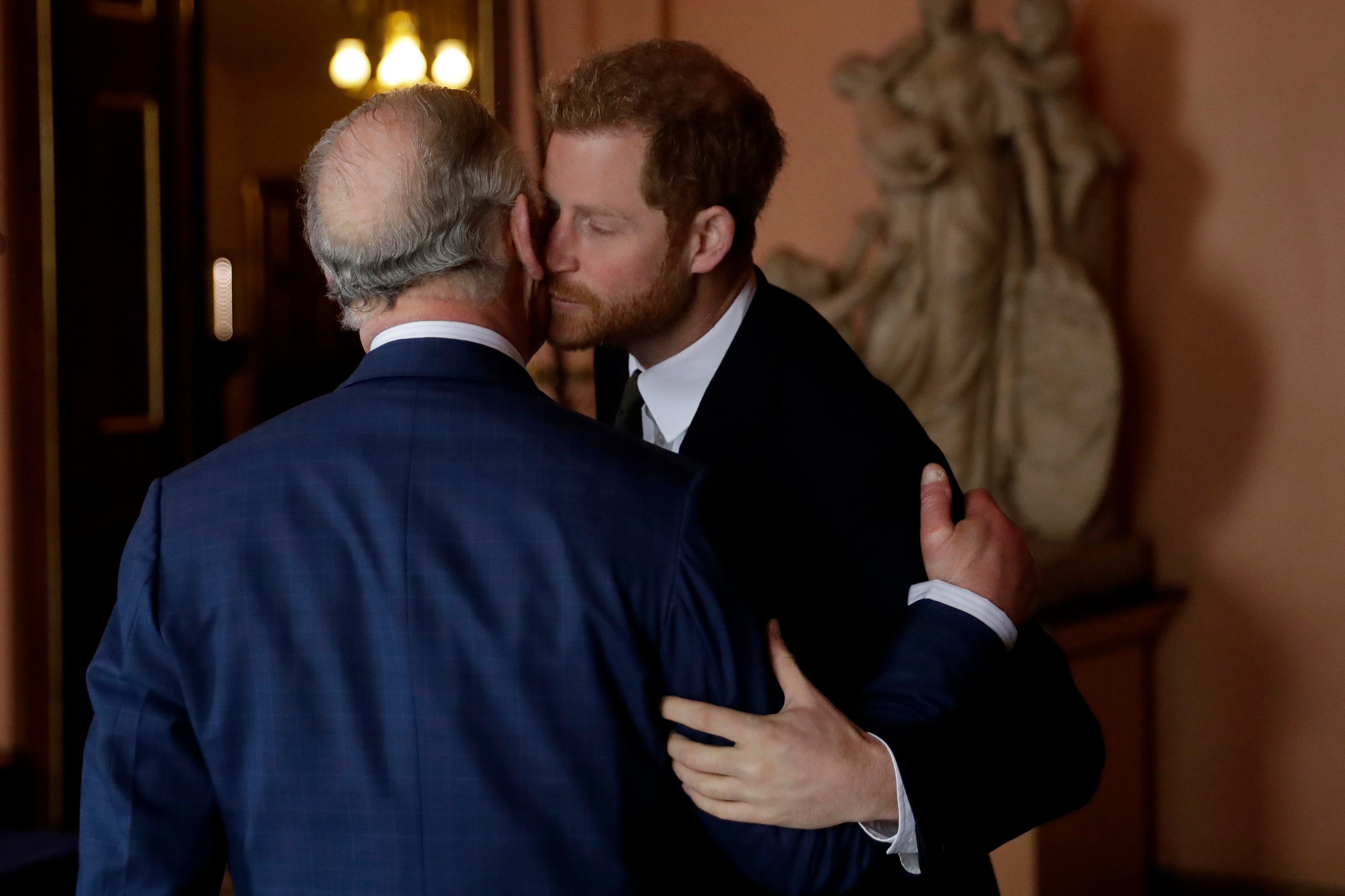 Prince Harry and his father, Prince Charles, arrive to attend the 'International Year of The Reef' meeting at Fishmongers Hall in London on February 14, 2018. / WPA Pool / Getty Images