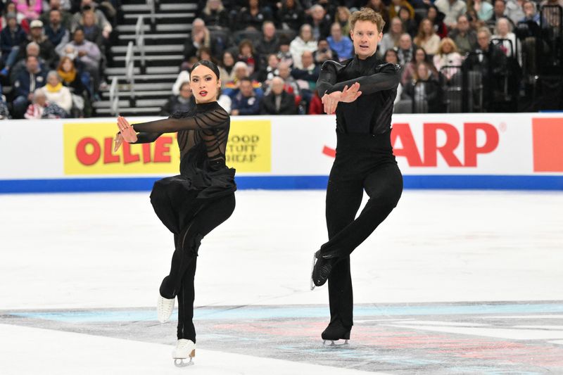 Jan 10, 2026; St. Louis, Missouri, UNITED STATES; Madison Chock and Evan Bates perform in the ice dance free dance during the 2026 U.S. Figure Skating Championships at Enterprise Center. Mandatory Credit: Jeff Curry-Imagn Images