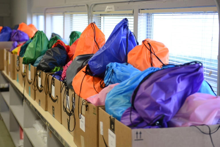 Filled snack backpacks fill up boxes intended for different schools as the McKinney-Vento Service Project helps feed homeless students over spring break inside Parkview Prep Academy in Jackson, Tenn., on Tuesday, Mar. 10, 2025.
