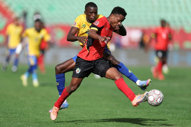 Gabon defender Mick Omfia (L) and Mozambique midfielder Geny Catamo battle for possession in Agadir.