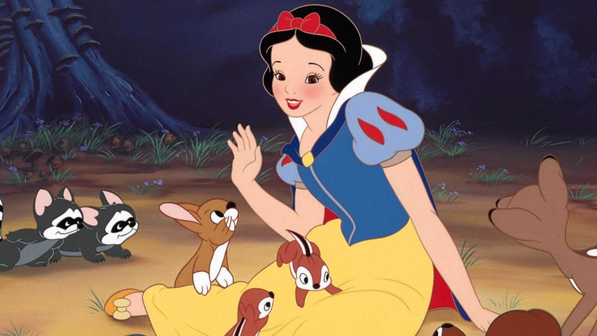 Snow White sits with woodland creatures in Snow White and the Seven Dwarfs