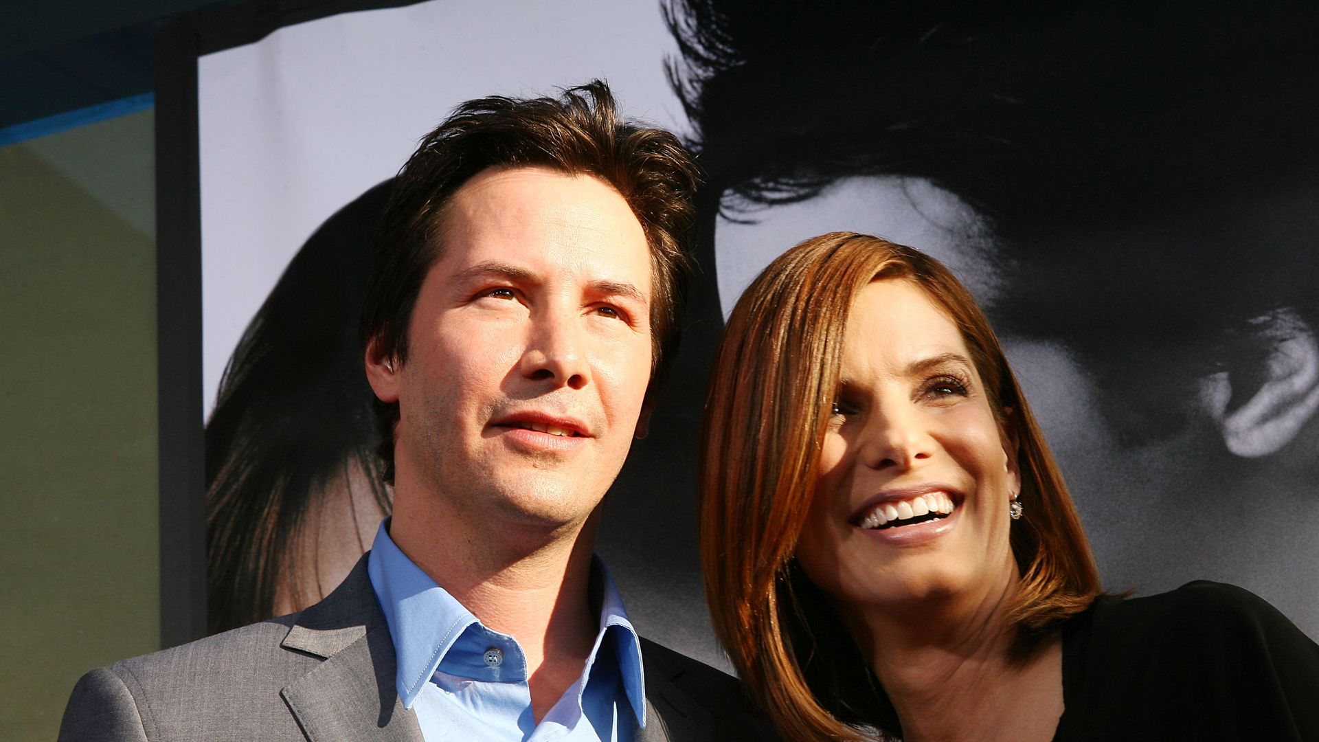 Sandra Bullock and Keanu Reeves share a sweet backstage reunion during