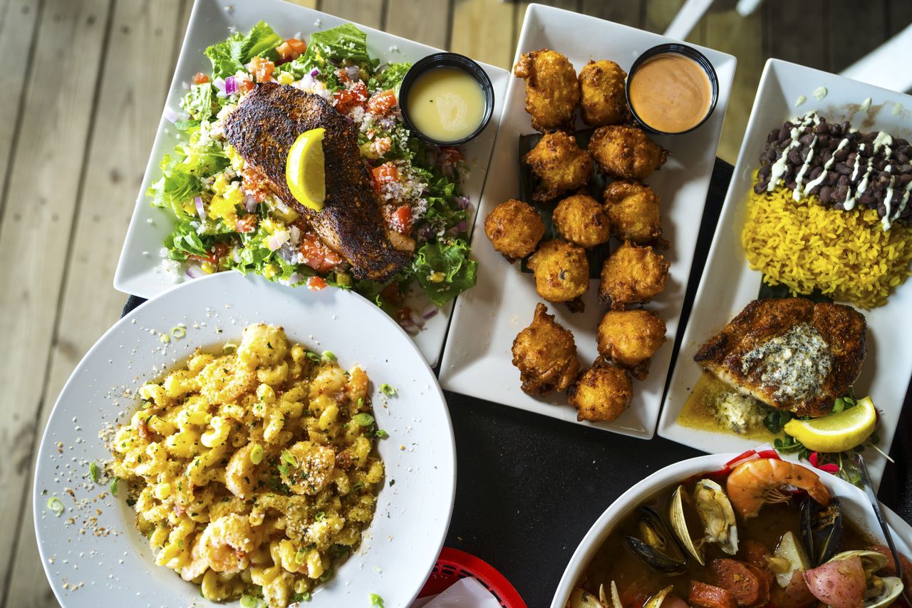 Assorted seafood dishes on a table at Conchy Joe's restaurant in Jensen Beach, Florida