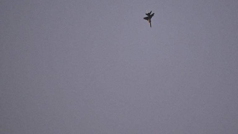 A pair of Chinese JH-7A fighter-bomber aircraft fly over the Taiwan Strait as seen from Pingtan Island in eastern China's Fujian province on Monday. - Adek Berry/AFP/Getty Images