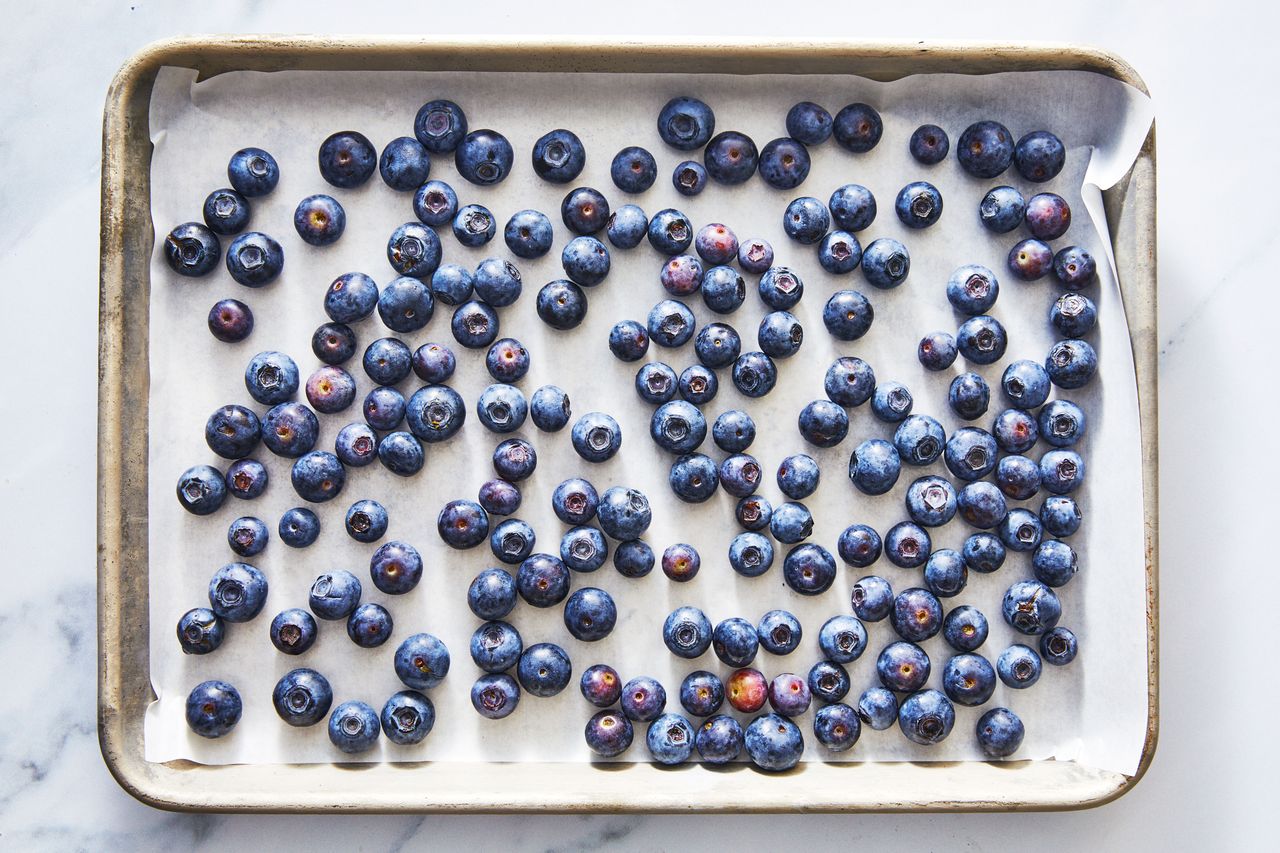blueberries on baking sheet for freezing