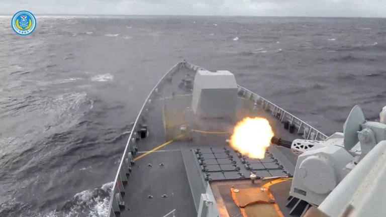 A ship fires a weapon during drills east of Taiwan, in this screenshot from a video released by the Eastern Theater Command of China's People's Liberation Army on Monday. - Eastern Theater Command/Reuters