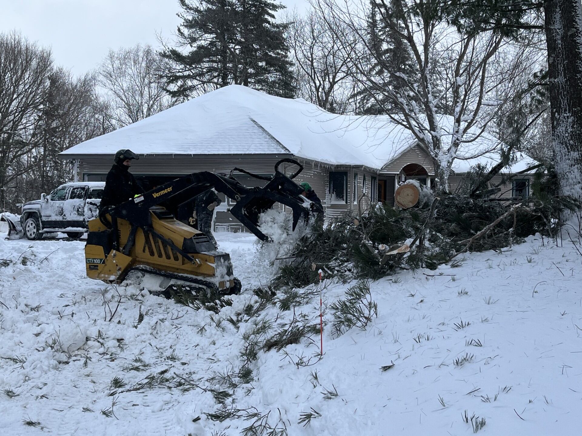 Crews clear downed lines and trees after UP winter storm
