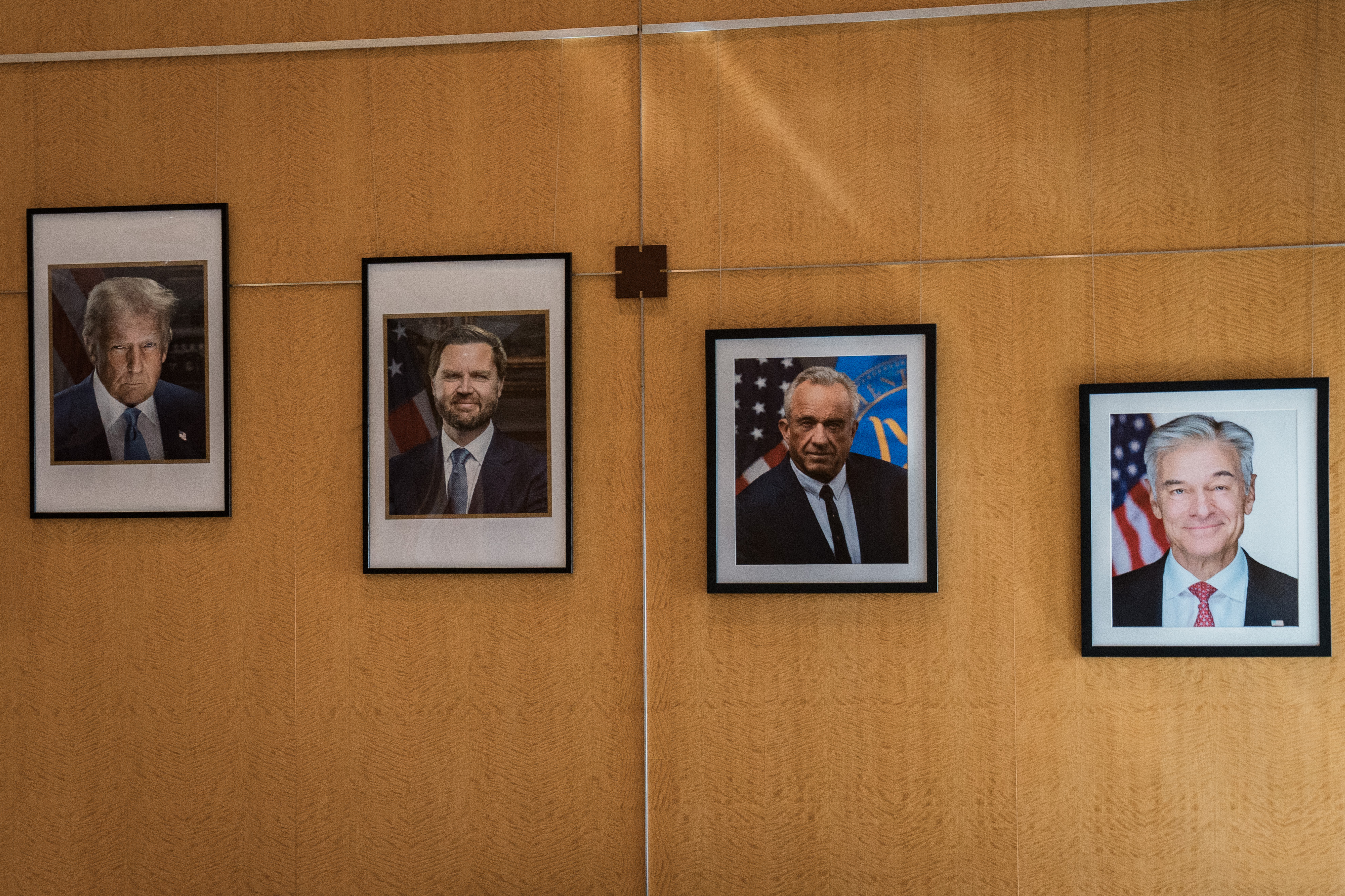Portraits of Trump, Vice President JD Vance, Kennedy and Mehmet Oz, administrator of the Centers for Medicare and Medicaid Services, at CMS headquarters.