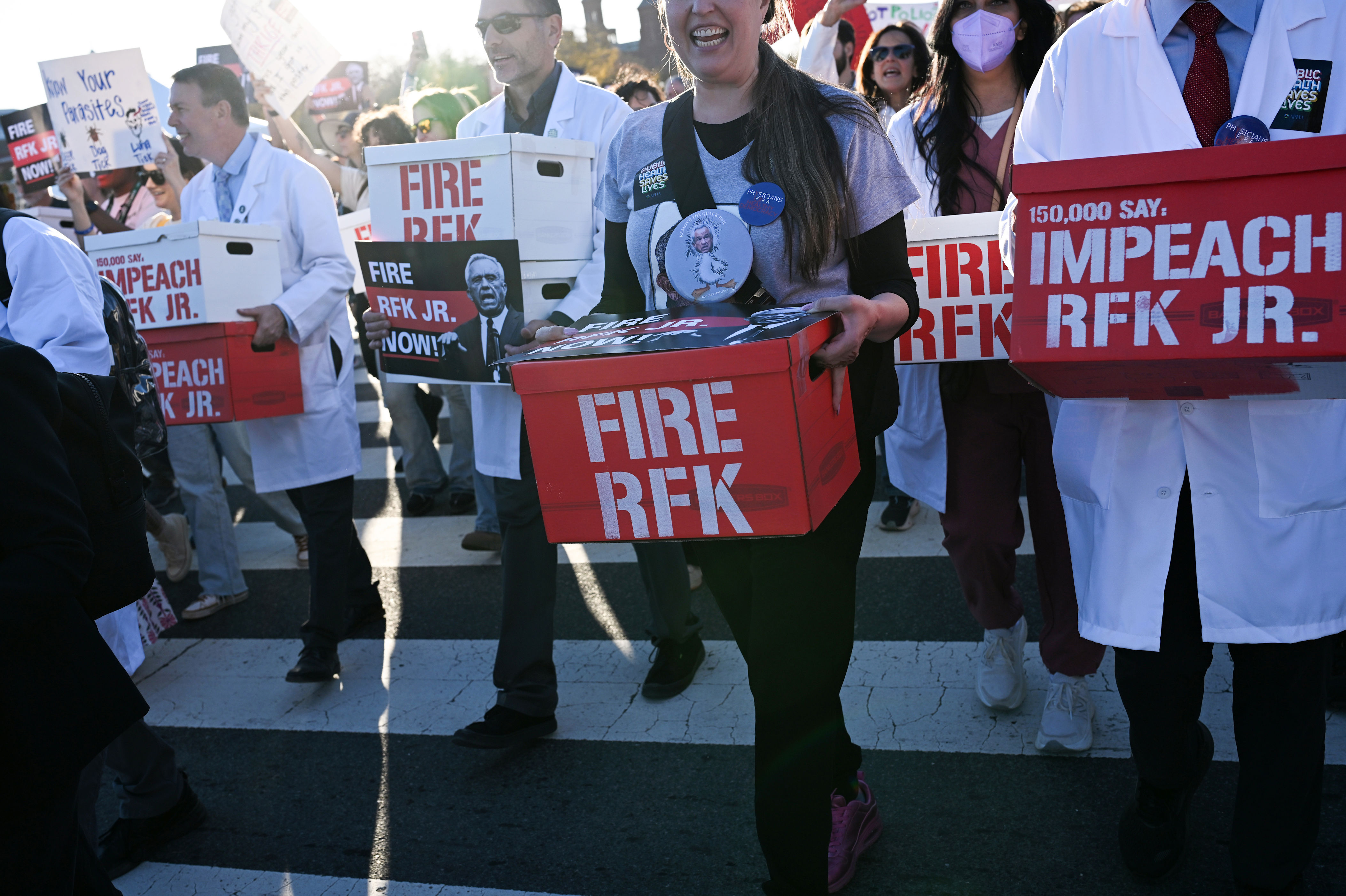 Protesters join the March for Health and Science in D.C. after the public health rally, delivering petitions calling for Kennedy’s removal.