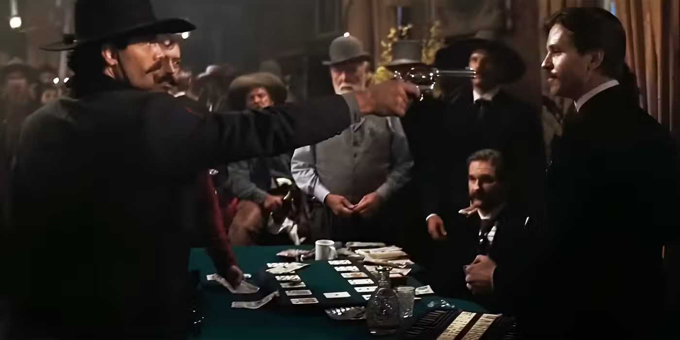 Johnny Ringo points a gun at Doc Holliday in Tombstone.