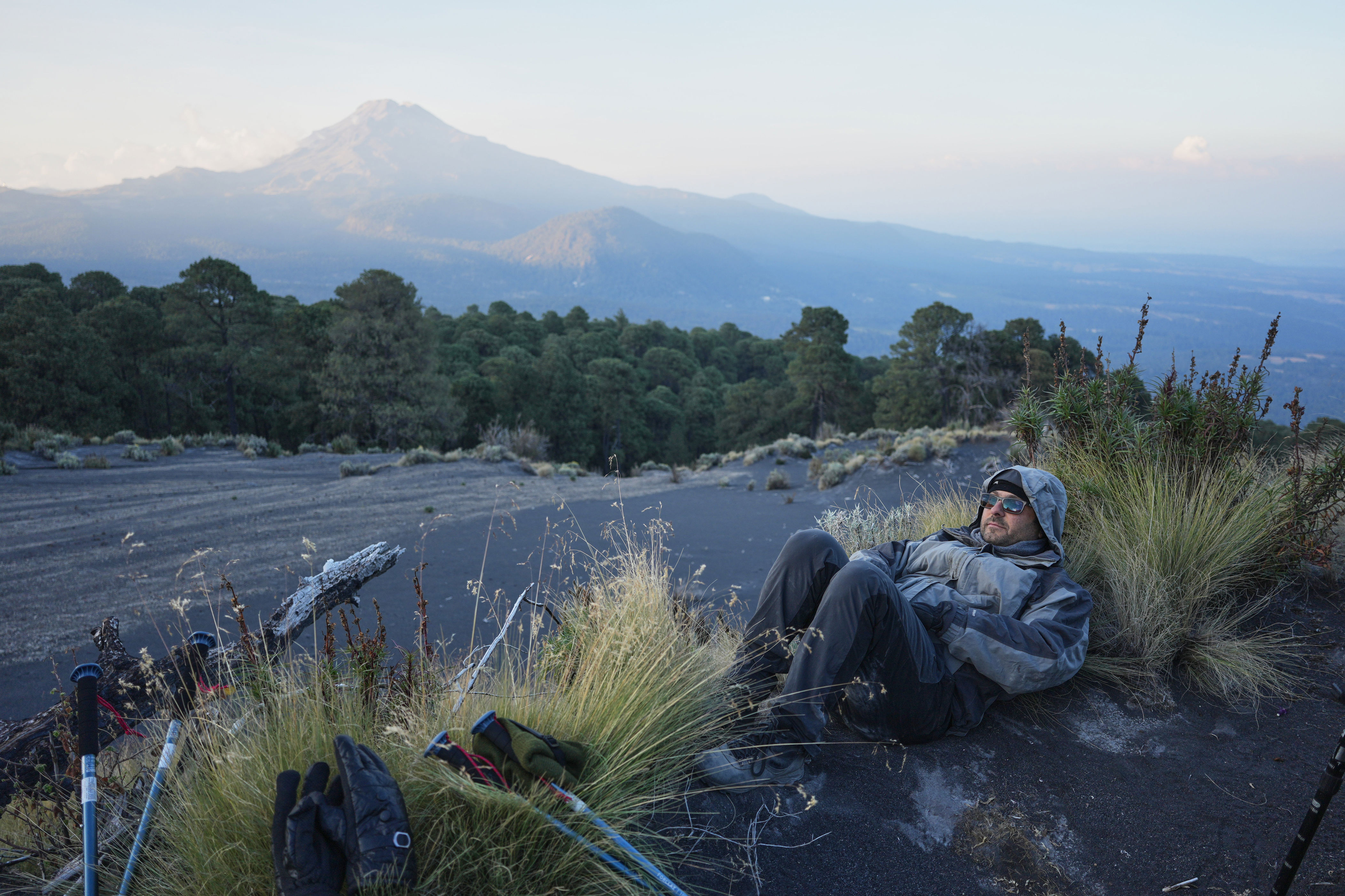 Marco Calo, a geophysicist at the National Autonomous University of Mexico (UNAM), rests near the campsite on the slopes of the Popocatepetl volcano, Mexico, Thursday, Dec. 4, 2025. (AP Photo/Eduardo Verdugo) (Copyright 2025 The Associated Press. All rights reserved.)