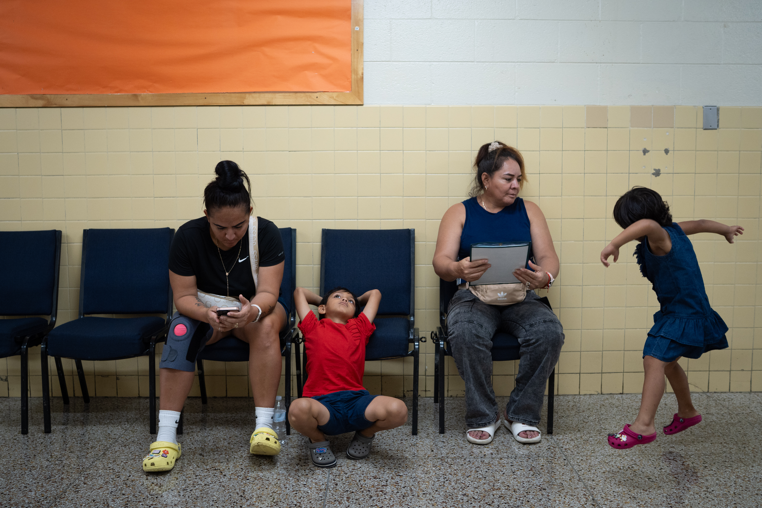 A family waits at the Bowie vaccine clinic ahead of the new school year.
