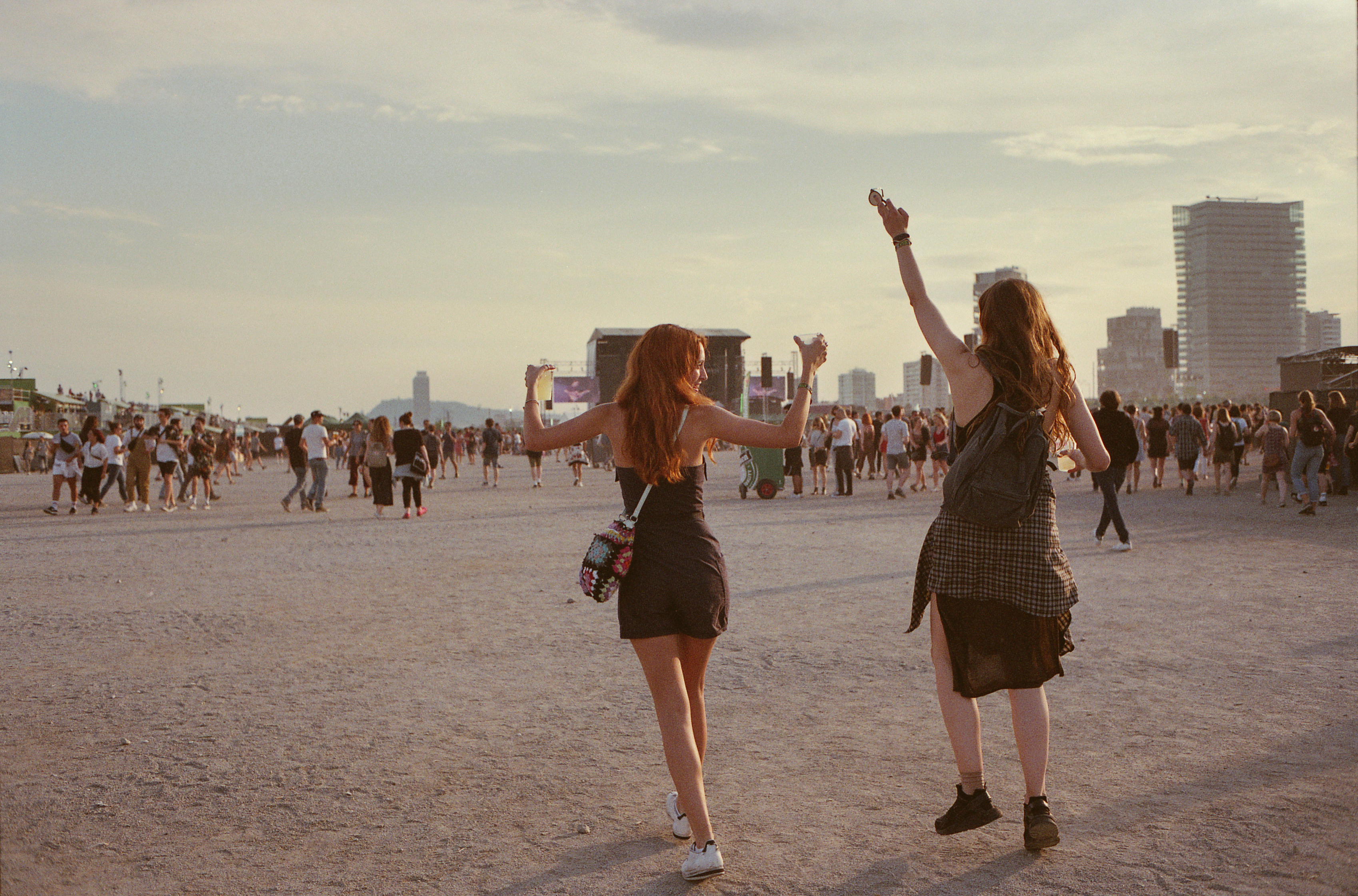 Two women are enjoying themselves at a music festival