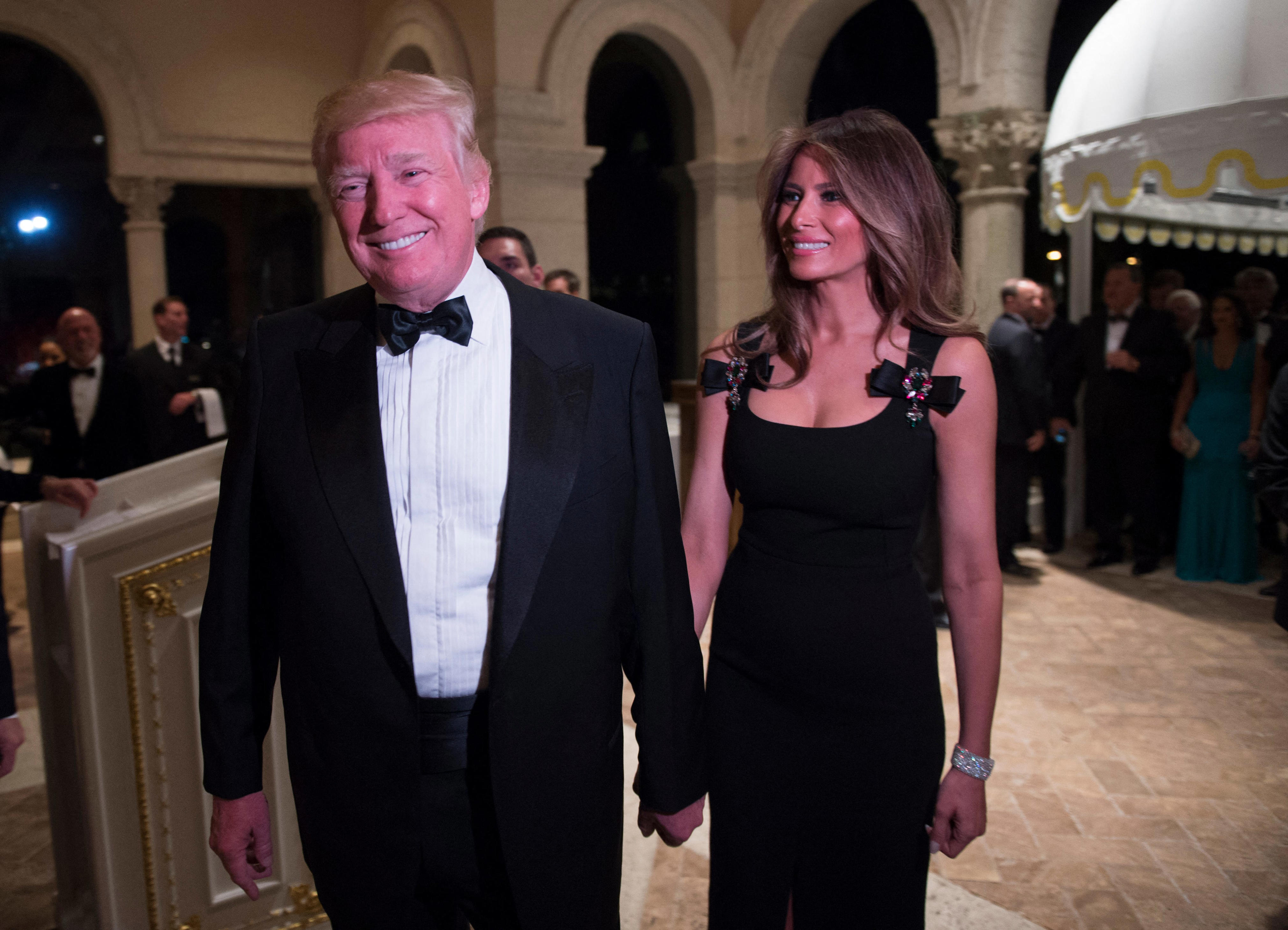 Then President-elect Donald Trump arrives with his wife Melania for a New Year's Eve party December 31, 2016 at Mar-a-Lago in Palm Beach, Florida.