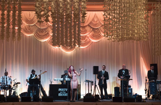 Party on the Moon performs during then US President-elect Donald Trump's New Year's Eve party December 31, 2016 at Mar-a-Lago in Palm Beach, Florida.