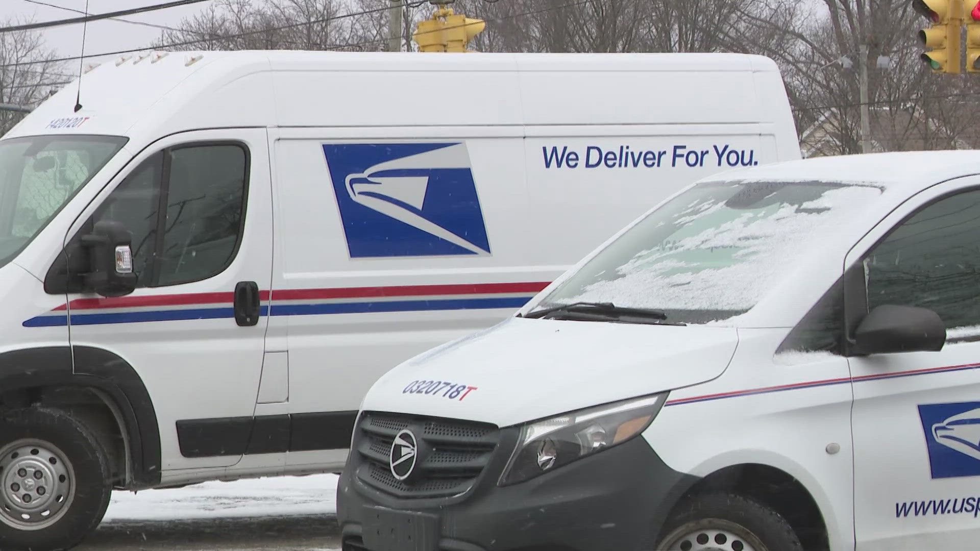 Postal worker robbed at gunpoint in Akron; suspects flee in SUV
