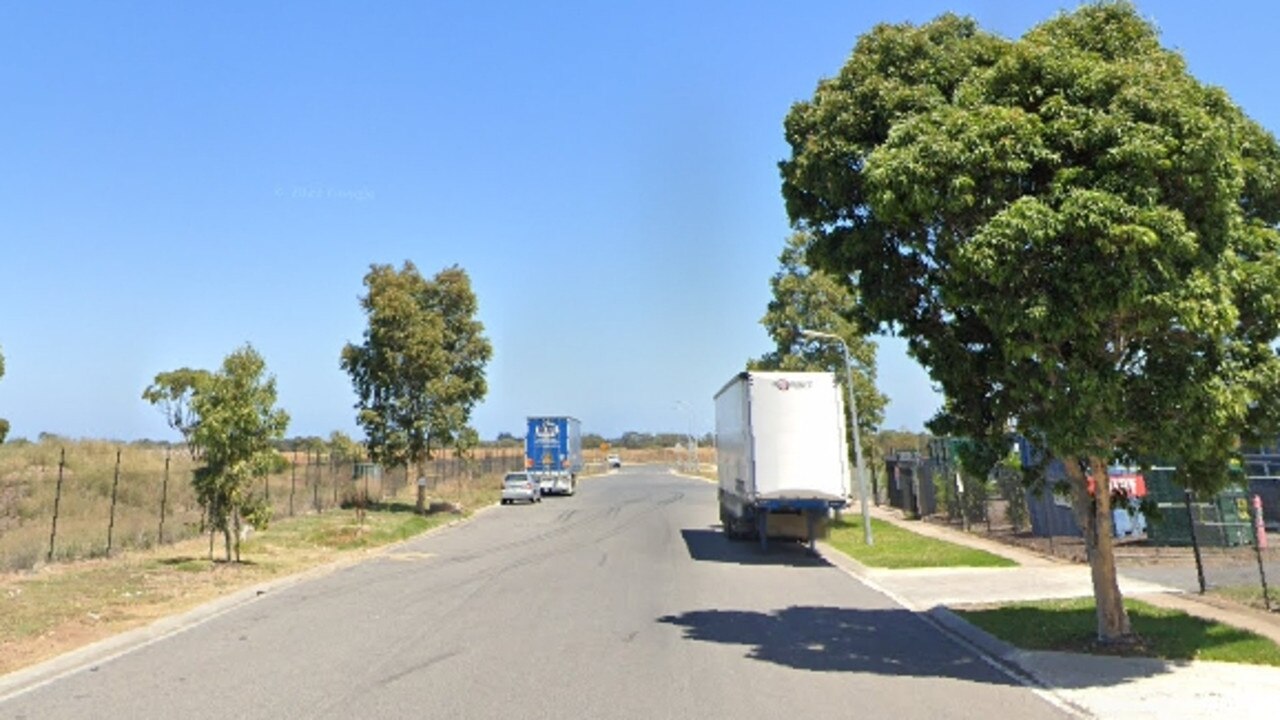 Woman dies after car hits parked truck