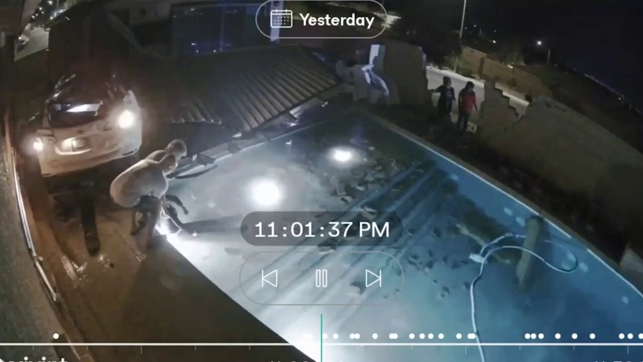 Video shows car crashing through wall and flipping over backyard pool as driver lands in water<br><br>