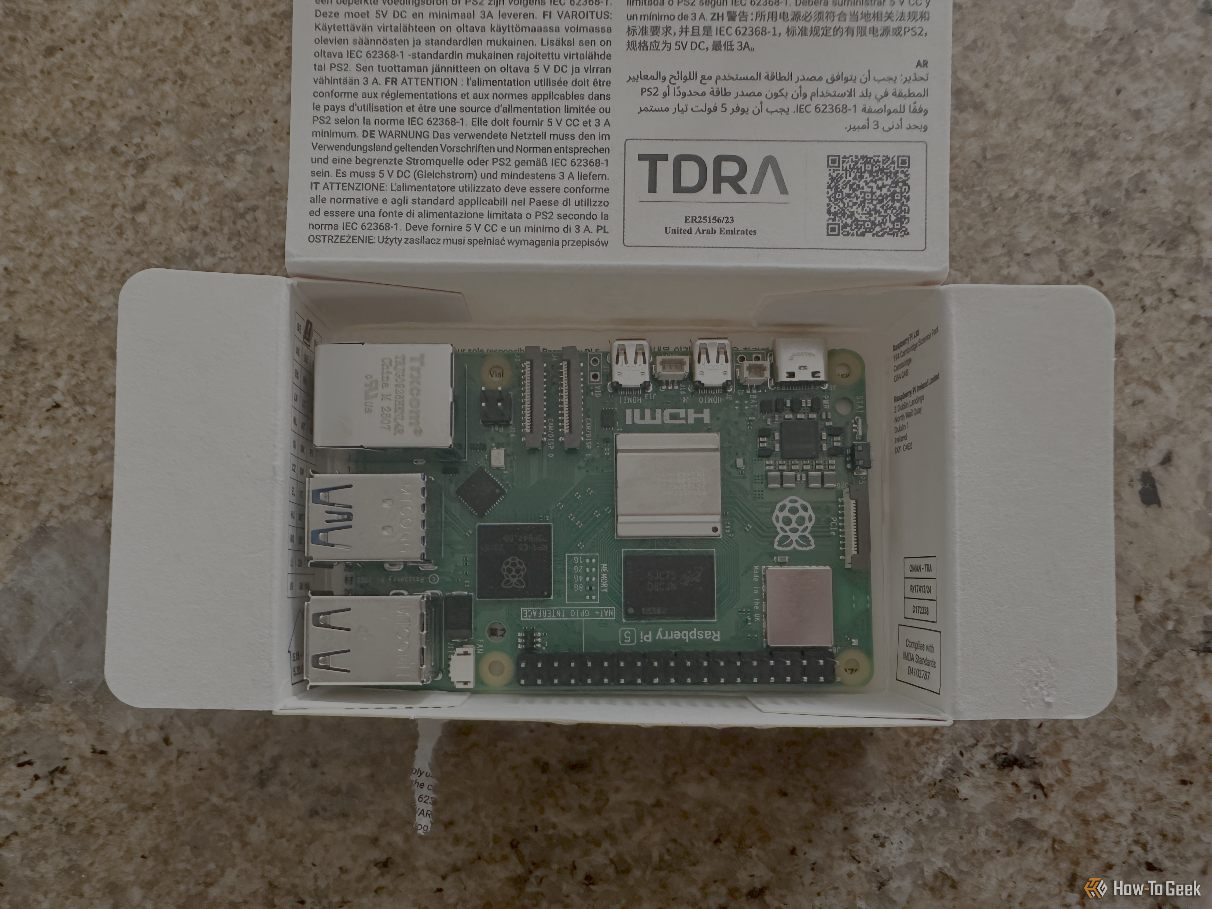 A brand new Raspberry Pi 5 still in the box without an active cooler.