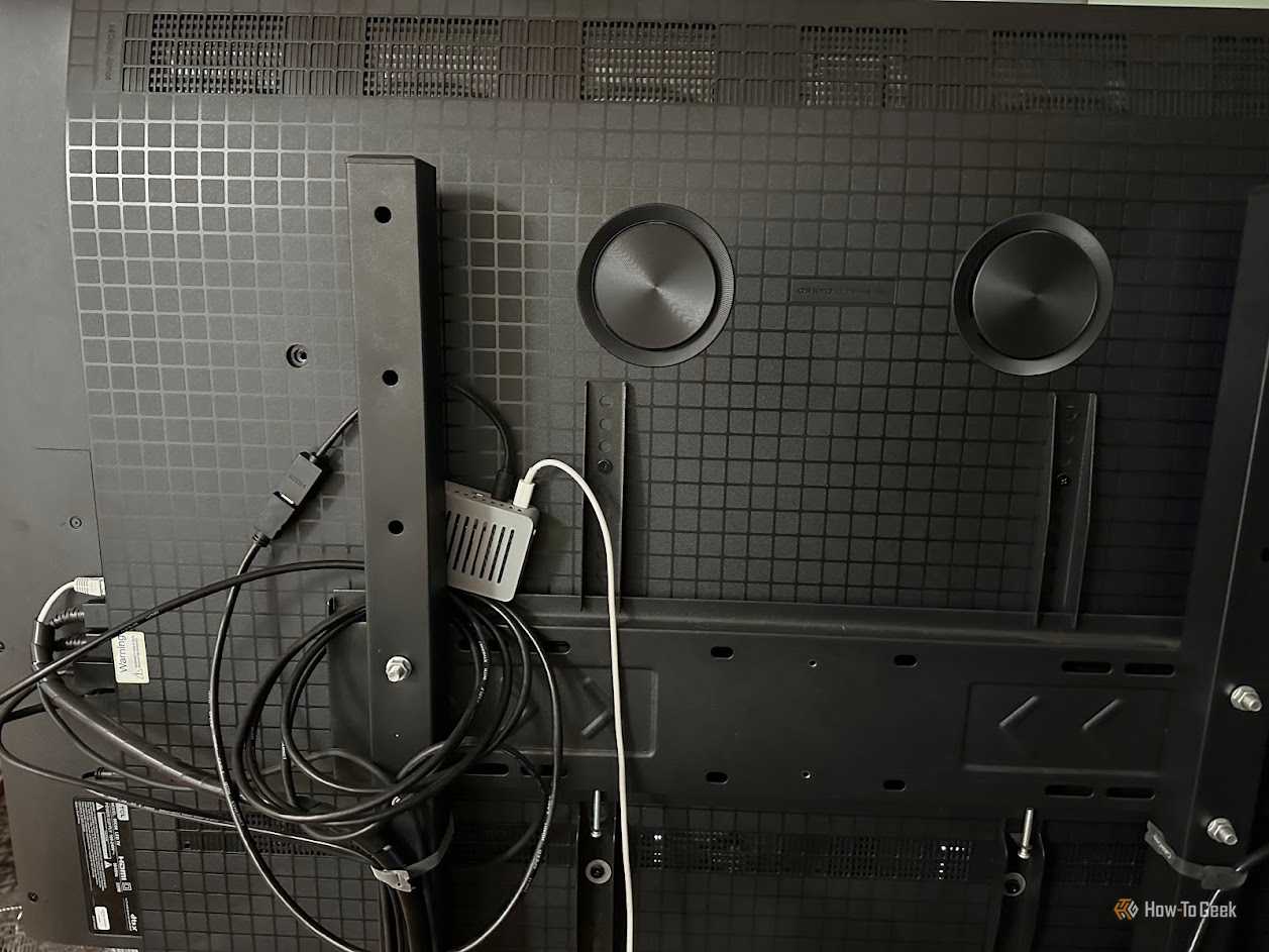 Raspberry Pi in a case, set up on the back of a TV.