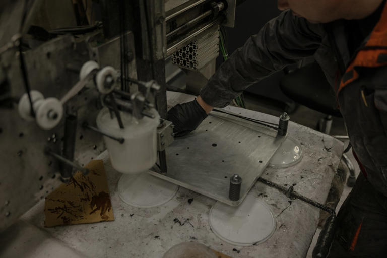 Ukrainian workers make parts for drones.