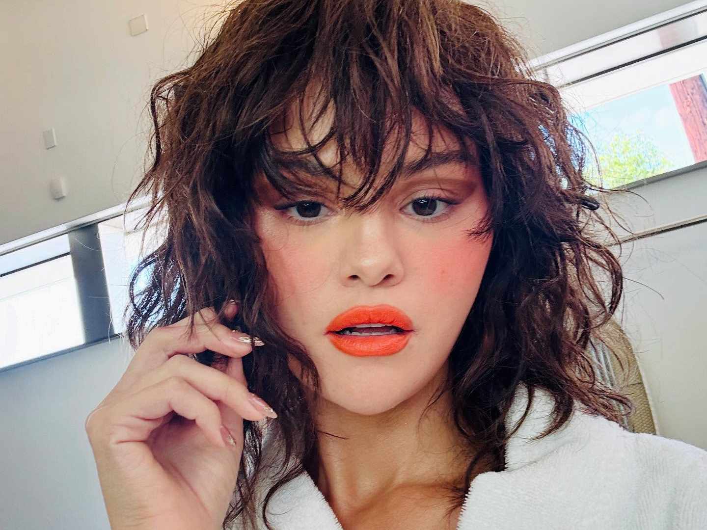 Butterfly cuts for short hair are the secret to that soft '90s volume