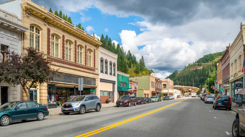 Downtown Wallace, Idaho with store buildings and mountains in the background