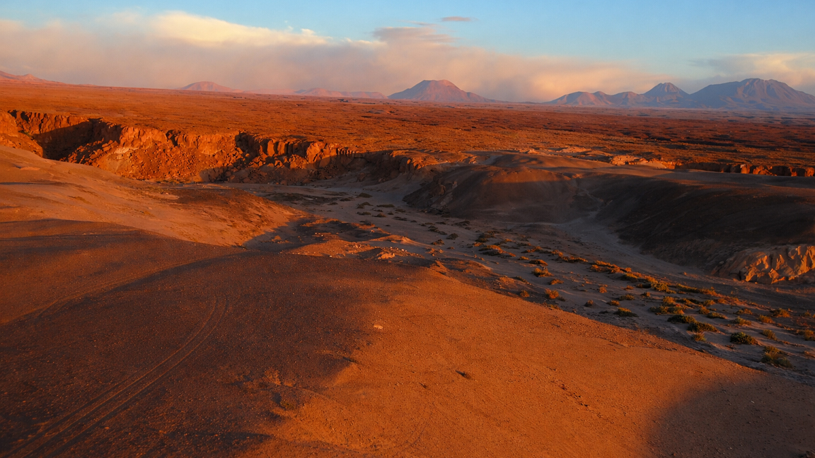 Endless red desert and distant mountains